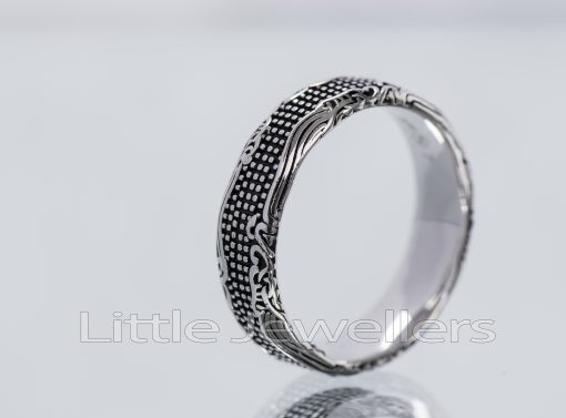 A unique oxidized silver ring is a nice addition to your every day outfit.