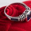 A vintage cz blue sapphire engagement ring