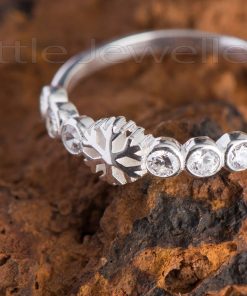 An adorable and feminine snow flake promise ring