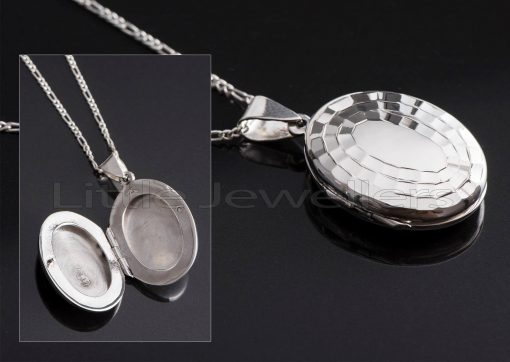 An enchanting oval shaped locket necklace that makes a lovely treasure to carry a photo of someone you cherish.