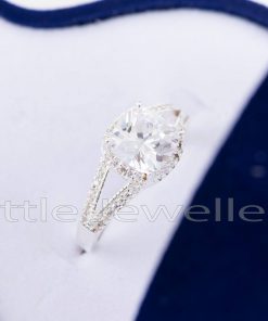 This stunning halo design engagement ring is a symbol of love & commitment to marry