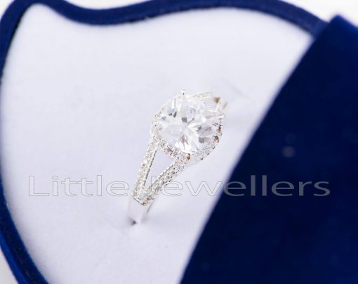 This stunning halo design engagement ring is a symbol of love & commitment to marry