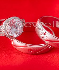 A beautiful blend of silver star engraved wedding ring set that is coupled with a stunning engagement ring.