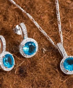 The sterling silver aqua necklace has a halo design and is ideal for adding an undersea vibe to any ensemble.