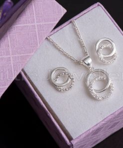 A silver necklace set with two Intertwined circles a symbol of unity, strength, and eternity.