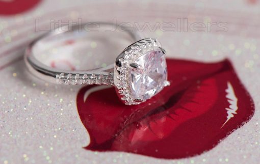 This Cushion cut Engagement Ring has a silvery touch of beauty about it.
