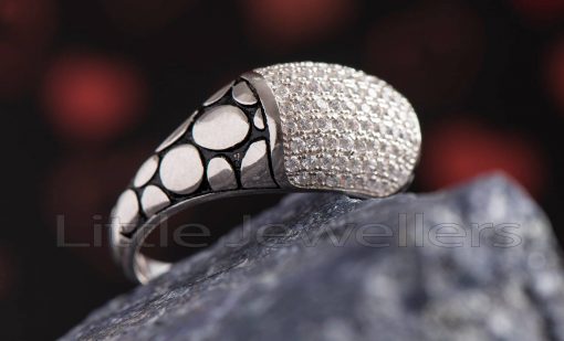 A silver ring with cubic zirconia accent stones that is suitable for both men and women. Handcrafted in exquisite silver, this piece is meant to be worn on a daily basis.