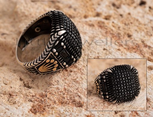 This square, onyx black, micro paved ring features a kings crown pattern on the side. It's a truly one-of-a-kind and stunning ring.
