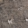 This sterling silver anklet with a butterfly design is a stylish everyday accessory.