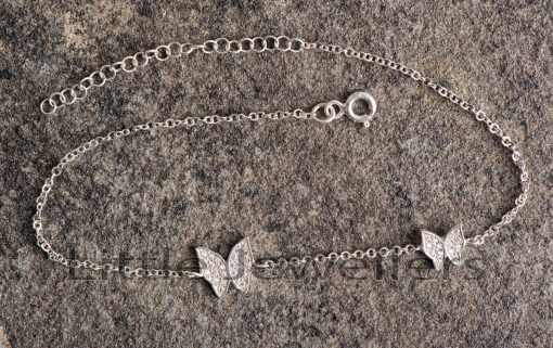 This sterling silver anklet with a butterfly design is a stylish everyday accessory.