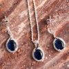With this matching necklace set, you can make a serious statement. This piece features blue sapphire cz stones and a halo design.