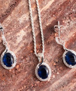 With this matching necklace set, you can make a serious statement. This piece features blue sapphire cz stones and a halo design.
