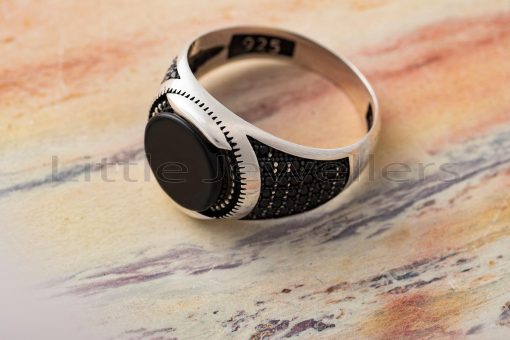 This sterling silver ring has a lovely black stone in the center and would make an excellent gift for any man.