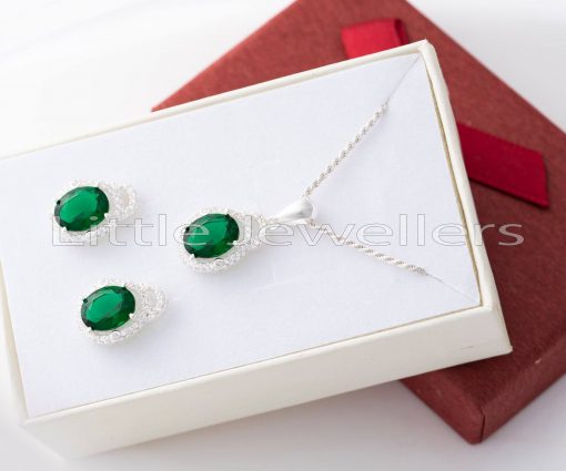The silver and green necklace is delicate but powerful, and it draws attention to the neck.