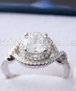 A glorious double halo engagement ring that has extra stones on the band for that added sparkle.