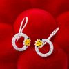 These yellow ladybug dangle earrings are a charming choice for little girls.