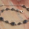 This stunning marcasite and cz sapphire bracelet has a pear shape and is made of sterling silver. It will quickly become a favorite accessory.
