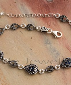This stunning marcasite and cz sapphire bracelet has a pear shape and is made of sterling silver. It will quickly become a favorite accessory.