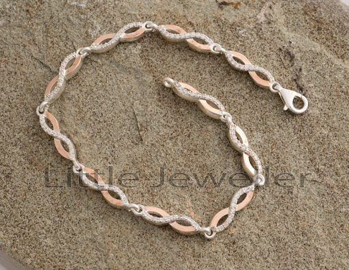 Allow this infinity bracelet to represent your everlasting bond. The design of this electroplated gold and solid silver bracelet is eye-catching from start to finish.