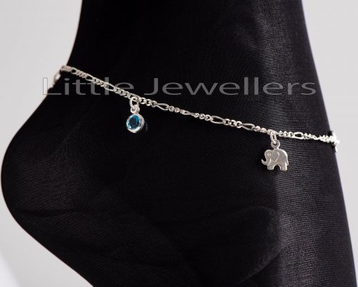 This anklet is made of a flawless silver chain and is embellished with three elephant charms and two tiny aqua marine cz stones to form a single cohesive design.