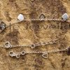 This lovely pure silver anklet with heart charms all around is a perfect gift for any occasion.