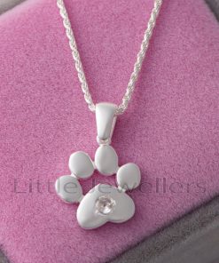 This dainty sterling silver paw pendant necklace has a playful yet elegant design.