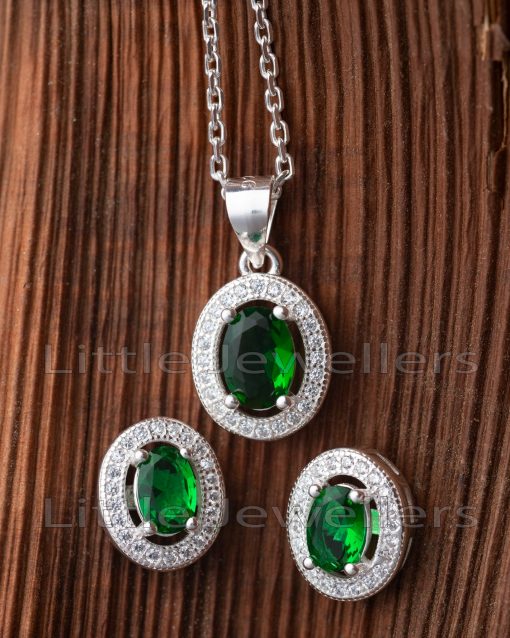 Make a statement with this stunning green emerald matching necklace set, which is surrounded by cubic zirconia stones.