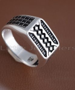 A sterling silver man's ring with a simple, elegant design that adds the final touch to any outfit.