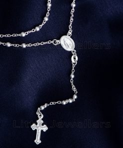 A very intricate silver rosary necklace that serves as a visible reminder of our faith & devotion to prayer