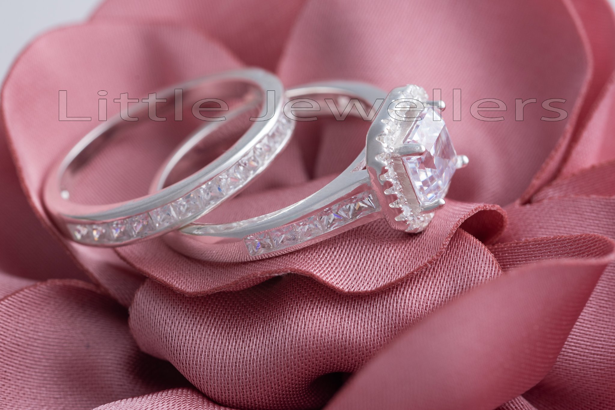 A timeless and classic sterling silver double engagement ring with an ...