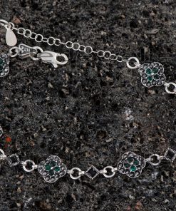 A stunning sterling silver green marcasite bracelet with a vibrant flower pattern.