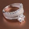 This engagement ring is stunning. A thick band with clear stones in an elegant and simple design.
