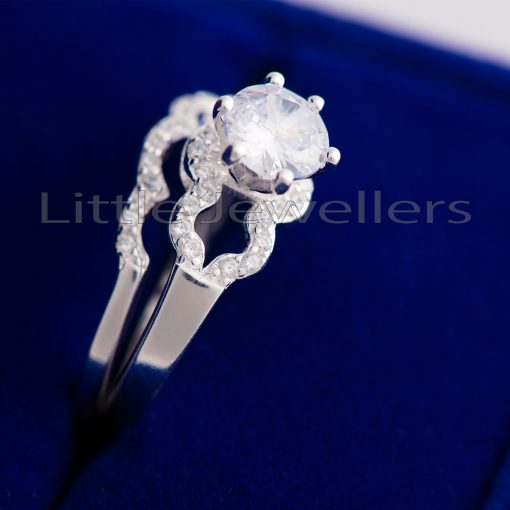 Brilliant zirconia stones adorn this elegant and stunning double silver engagement ring.