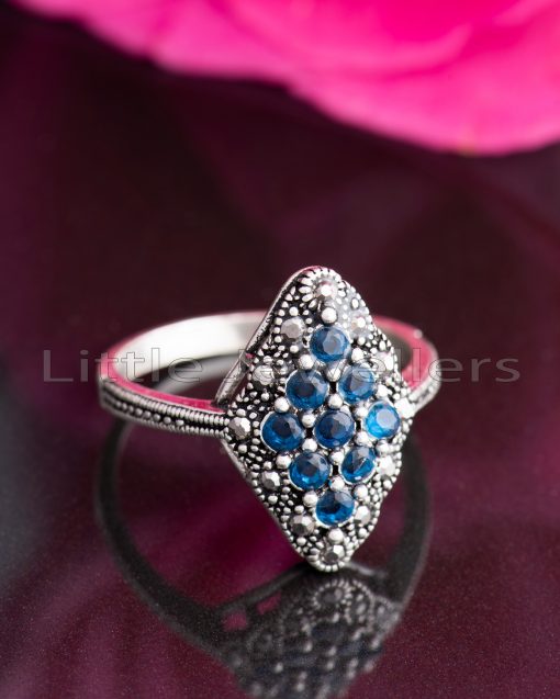 Show off your birthstone with this elegant marcasite vintage style blue stone silver ring for women.