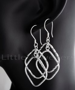 Sterling silver dangle earrings that are easy to wear and have a captivating textured design.