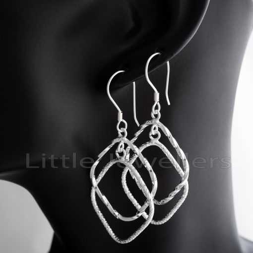 Sterling silver dangle earrings that are easy to wear and have a captivating textured design.