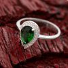 Make a timeless promise of love with this beautiful and unique emerald green pear-shaped promise ring
