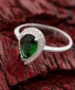 Make a timeless promise of love with this beautiful and unique emerald green pear-shaped promise ring