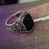 Add a touch of elegance and authority to your look with this bold and beautiful Intricately Crafted Silver Ring featuring an Onyx black zirconia stone embraced by marcasite.