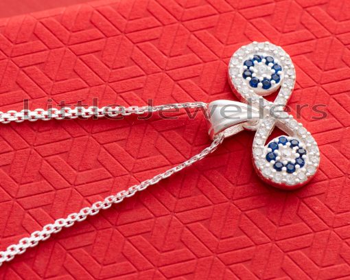 This elegant and stylish infinity evil eye necklace is great for any woman looking to add a touch of protection and style to her outfit.