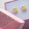 A pair of vibrant and brilliant yellow silver stud earrings that will complement any outfit.