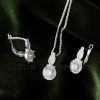 Make a statement with this dazzling silver necklace set. Featuring a delicate halo design pendant, and matching earrings