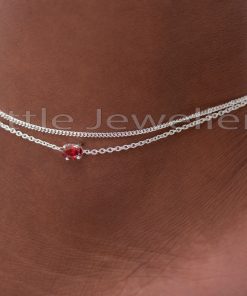 Bring a bit of elegance to your look with this exquisite sterling silver anklet! It has a sturdy double link chain with a dazzling red stone and is hypoallergenic, making it perfect for adding a statement to your style.