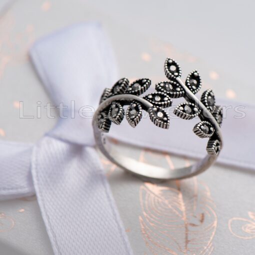 The Leaf Ring with Marcasite Stones is a beautiful piece of jewelry made of sterling silver with tiny marcasite stones and an elegant vine design inspired by nature.