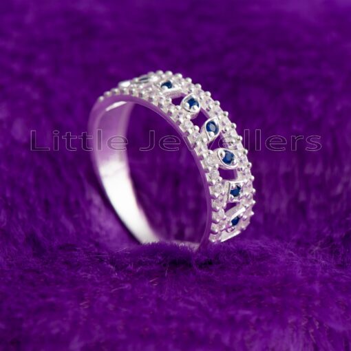Give her the perfect anniversary gift with this beautiful half eternity ring. Crafted from sterling silver and sparkling sapphire gems, it's the perfect jewelry gift for her