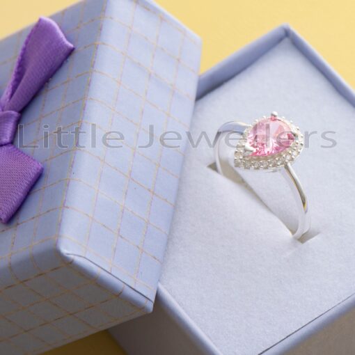 Show her your commitment with our timeless promise ring for women. Crafted from sterling silver, this pink ring is adorned with twinkling stones and is sure to make a lasting impression.