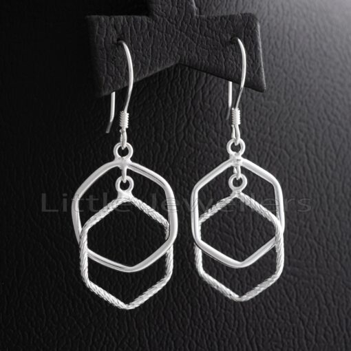 Add a touch of class to any ensemble with our new, textured double hexagon drop earrings in sterling silver. Be chic and stylish in Nairobi with these unique dangle earrings.