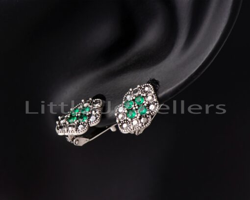 Get a stylish and comfortable pair of sterling silver latch back earrings with green and marcasite gems. Perfect for that special someone who loves fashion and comfort. Perfect gift for any occasion.