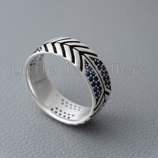 Look unique and stylish with our luxurious sterling silver men's ring featuring blue stones and a unique pattern. Perfect for making a lasting statement and standing out in the Kenyan fashion scene.
