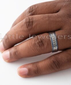 Show your love in style with this exquisite silver wedding ring. Featuring a unique pattern of small blue stones, it’s the perfect blend of luxury and subtlety for the modern gentleman.